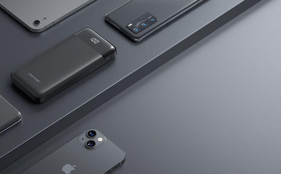 Charmast portable power bank on a white background, showing its three built-in charging cables for Lightning, USB-C, and Micro-USB devices.