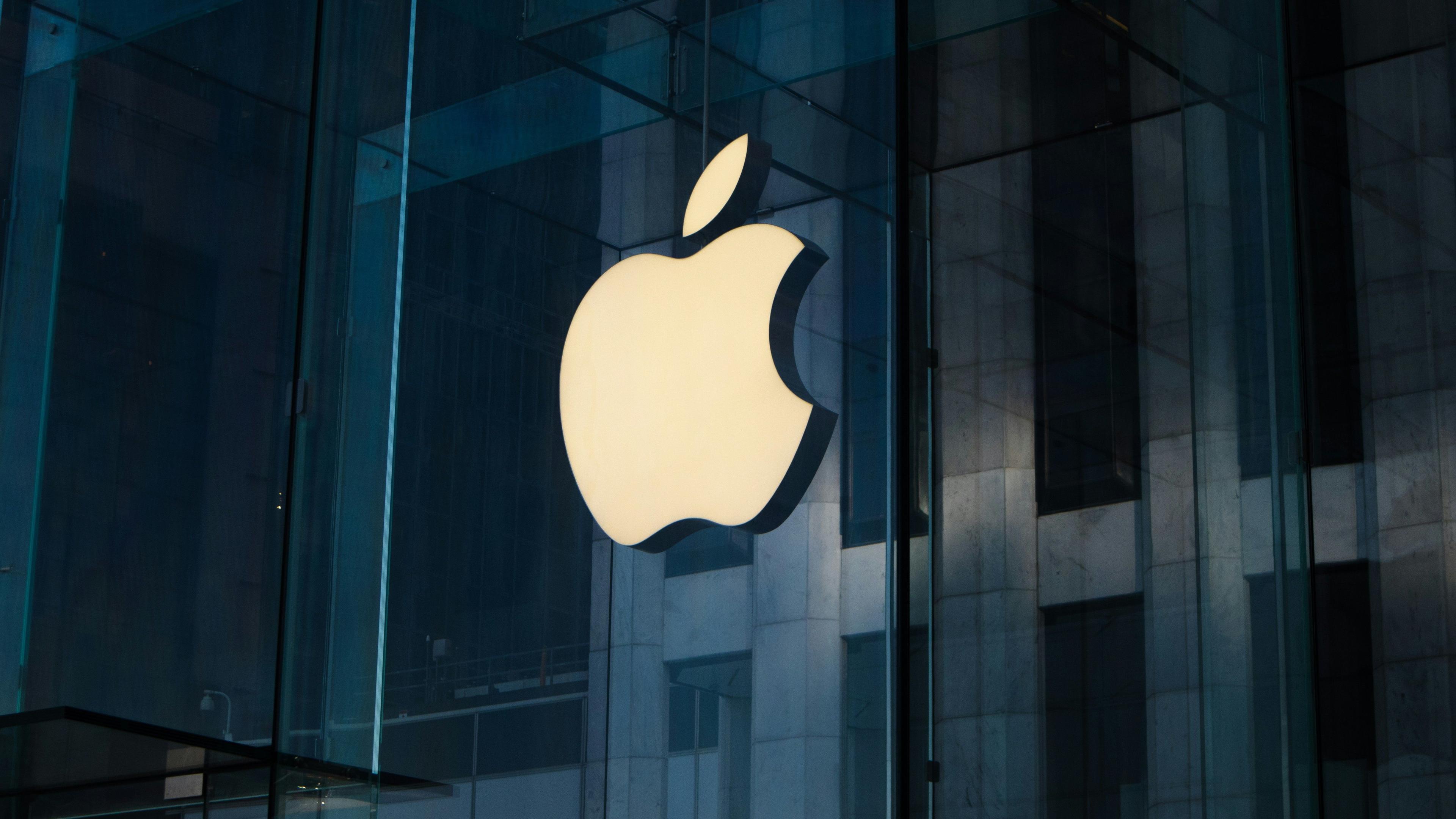 Apple logo on a glass building